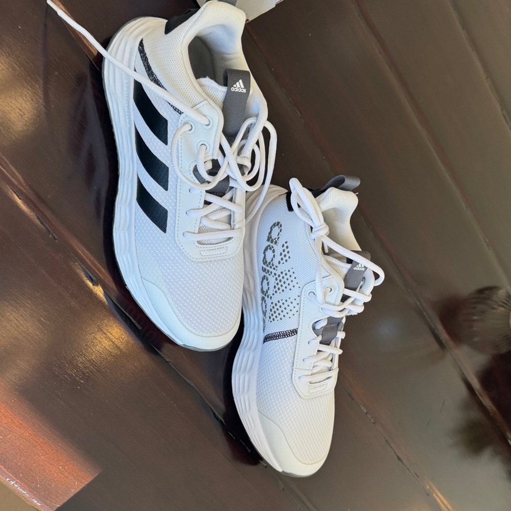 Never worn Adidas Own the Game 2.0 basketball shoes.